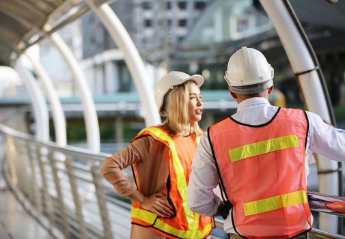 Construction engineers discussion with architects at construction site or building site