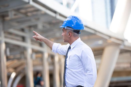 Construction engineers discussion with architects at construction site or building site