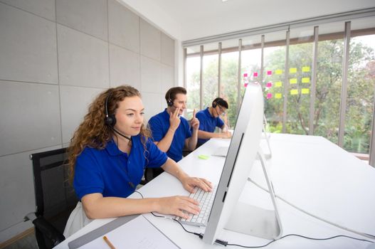 Call center operator in headset while consulting client. Telemarketing or phone sales. Customer service and business concept.