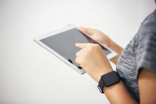 close up hands multitasking woman using tablet, laptop and cellphone connecting wifi