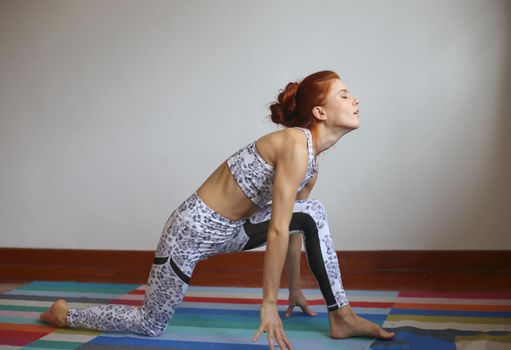 Women practice yoga at home