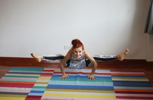 Women practice yoga at home