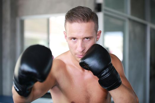 young athlete people with boxing gloves, exercise in fitness gym