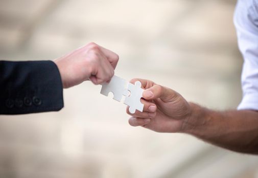 Business people shaking hands, finishing up a papers signing. Meeting, contract and lawyer consulting concept.