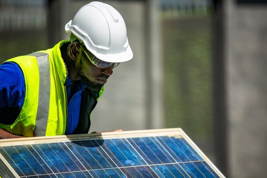 maintenance engineer, Solar energy systems engineer perform analysis solar panels, Portrait of engineer man or worker, people, with solar panels or solar cells on the roof in farm. Power plant with green field, renewable energy source in American. Eco technology for electric power.