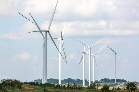 clean energy power concept, wind turbine and cloud sky.