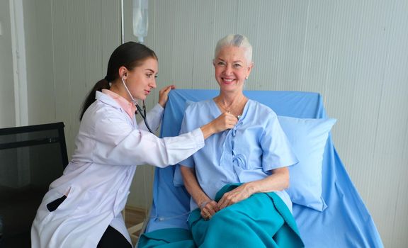 Femen doctor and elderly patient, Female doctor doing medical exam to a senior woman 