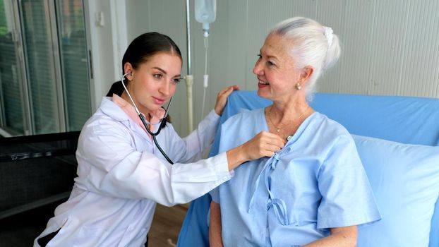 Female doctor and elderly patient, Female doctor doing medical exam to a senior woman