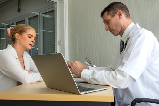 Doctor check up and discuss with patient in clinic or doctor talk with women patient in hospital