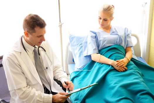 Doctor check up and discuss with patient in clinic or doctor talk with women patient in hospital