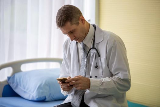 portrait of male doctor standing with confidence in hospital.