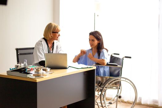 Doctor check up and discuss with patient in clinic or doctor talk with women patient in hospital