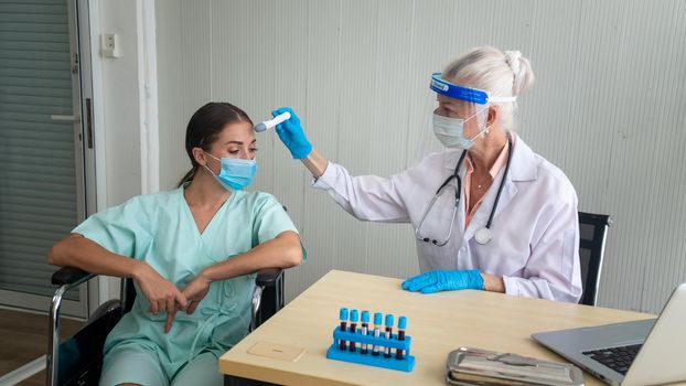 Coronavirus protection during the quarantine, Female doctor doing medical exam to a women patient.