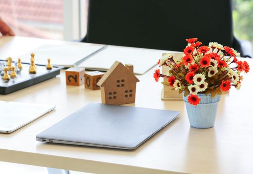 Close-Up Of Model Home On Wooden Table for Real Estate and loan concept