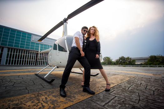 Business people traveling by helicopter , Shot of a mature businessman using a headset while traveling in a helicopter