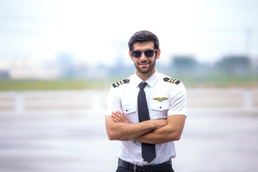 Shot of a mature Helicopter pilot using a headset while traveling in a helicopter, Business people traveling by helicopter