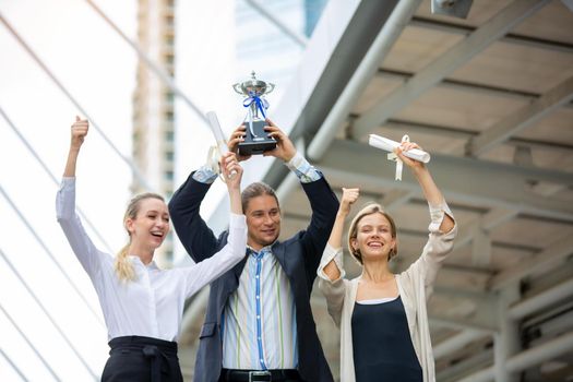 Business People Walking Handshake Professional Urban City Concept., Business people working in office on desktop computer, Group of happy business people in smart casual wear looking at the laptop and gesturing. Achieving success.