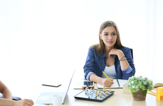 Business people working in office on desktop computer, Group of happy business people in smart casual wear looking at the laptop and gesturing. Achieving success.