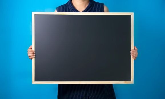 women holding blackboard.