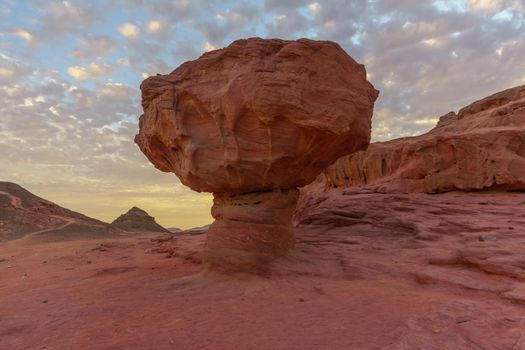 Sunset view of landscape and the Mushroom rock formation, in the Timna Valley, Arava desert, southern Israel