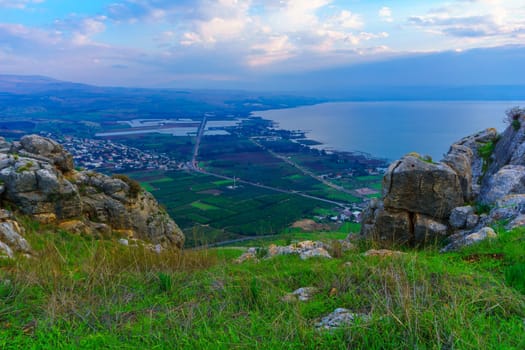 Morning view of the north part of the Sea of Galilee, and the village Migdal, from mount Arbel. Northern Israel