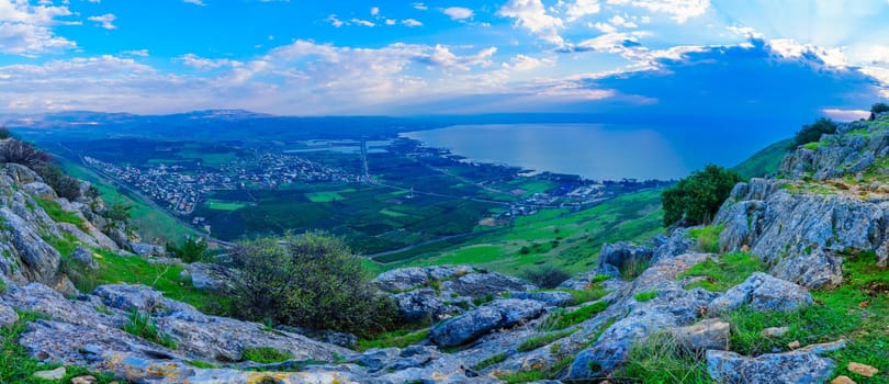 Panoramic morning view of the north part of the Sea of Galilee, and the village Migdal, from mount Arbel. Northern Israel