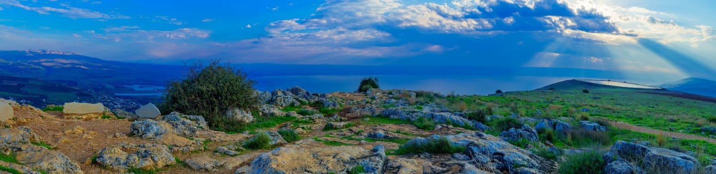 Panoramic morning view of the Sea of Galilee, with Sun beams, from the west (mount Arbel). Northern Israel. Text is Observation point name and directions