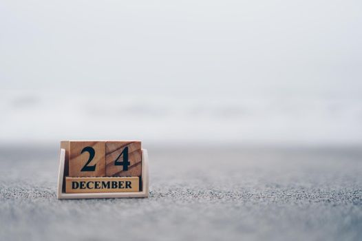 Wooden brick block show date and month calendar of 24th December or Chritstmas day. Celebration and holiday long weekend season concept.