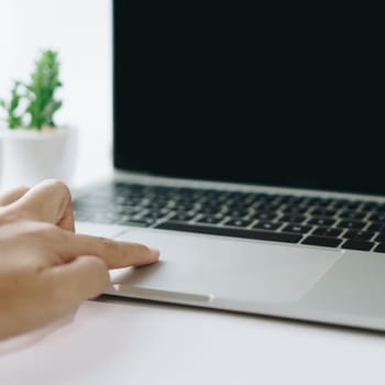 Woman using laptop and smartphone to work or study. Business, financial, trade stock maket and social network concept.