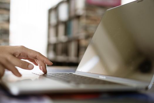 People using laptop to work study on work desk. Business, financial, trade stock maket and social network concept.