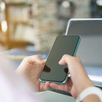 Woman hand using smartphone to do work business, social network, communication concept.