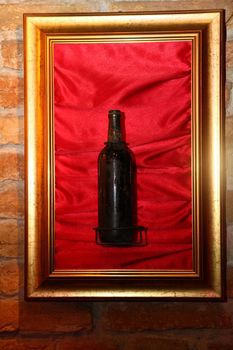 a bottle of wine in a frame
