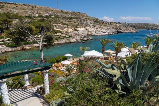 Scenic view on the bay with turquoise water and the beach of Kalithea Springs at Greek island Rhodes 