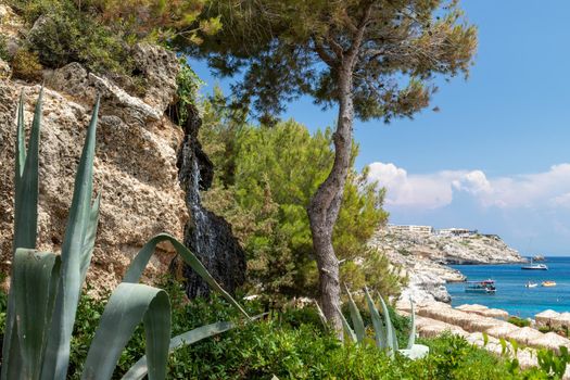 Scenic view on the bay with turquoise water and the beach of Kalithea Springs at Greek island Rhodes 