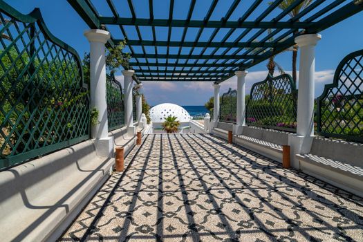 Path with pergola and mosaic pavement at Kallithea Therms, Kallithea Spring on Rhodes island, Greece