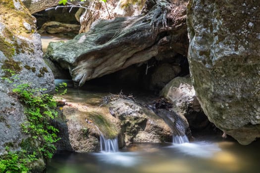 Water course with rocks in the valley of butterflies (Petaloudes) on Greek island Rhodes 