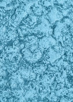 Grunge uneven background of blue stone texture pattern