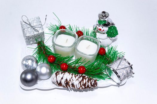 Simple homemade Christmas decorations with two small candles