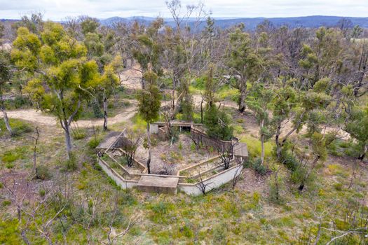 Aerial photograph of structural ruins and forest regeneration after bushfires near Clarence in the Central Tablelands in regional New South Wales in Australia