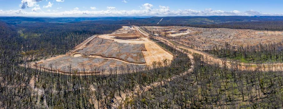 Aerial view of forest regeneration after bushfires and a new Quarry being built in regional Australia