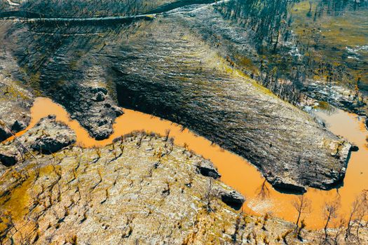 Aerial view of a water reservoir surrounded by forest regeneration after bushfires in Dargan in the Central Tablelands in regional New South Wales Australia