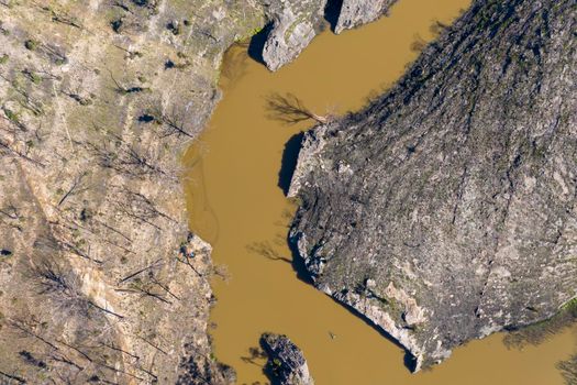 Aerial view of a water reservoir surrounded by forest regeneration after bushfires in Dargan in the Central Tablelands in regional New South Wales Australia