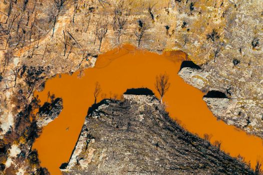 Aerial view of a water reservoir surrounded by forest regeneration after bushfires in Dargan in the Central Tablelands in regional New South Wales Australia