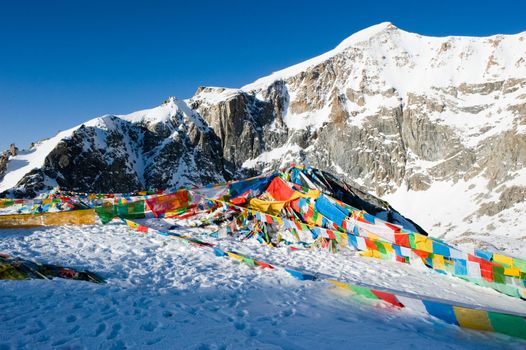 Colored rags on a rope in Tibet. Rituals and beliefs.