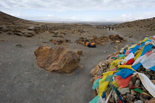 Colored rags on a rope in Tibet. Rituals and beliefs.