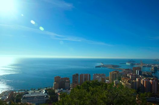 View on the blue bay with houses and trees, mediterranean sea, Malaga, Spain