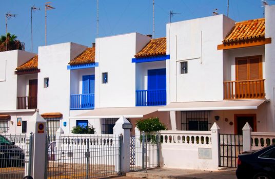 White summer houses with color details, summer, Spain