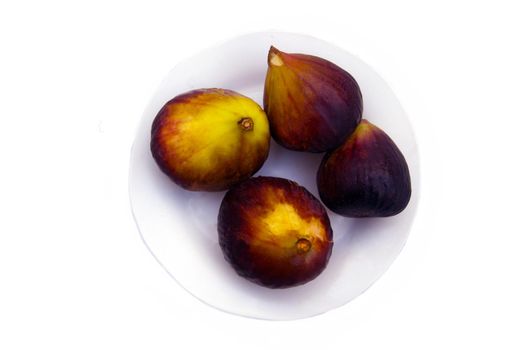 Four big violet and yellow figs in white background