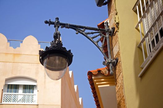 Lantern on the wall of the house, summer, Spain