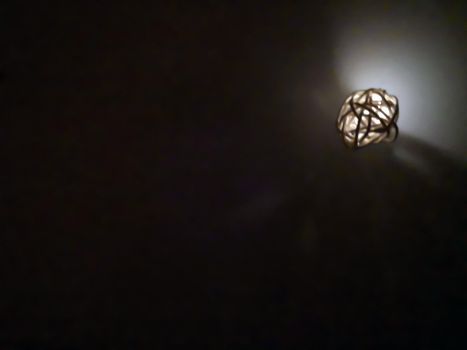 One small decorative luminous ball, night time, macro